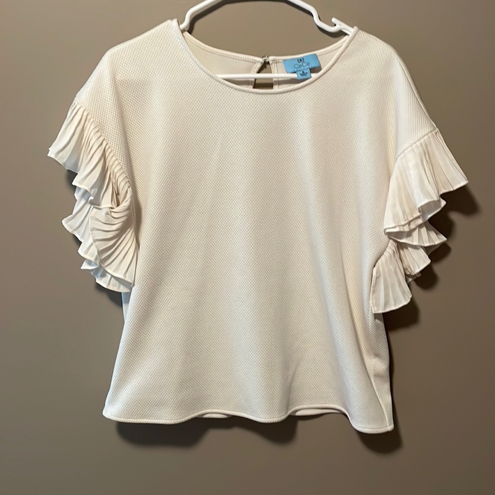 Cece Brand cream colored short sleeve shirt with pleated butterfly sleeves.